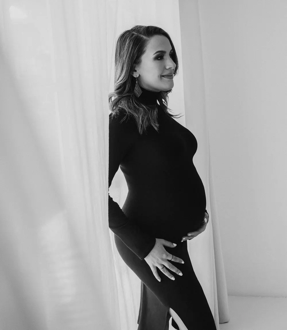An expectant mother in a studio portrait