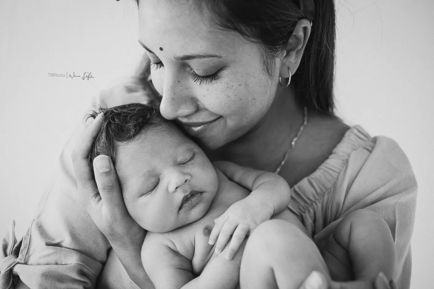 A mother holding her newborn
